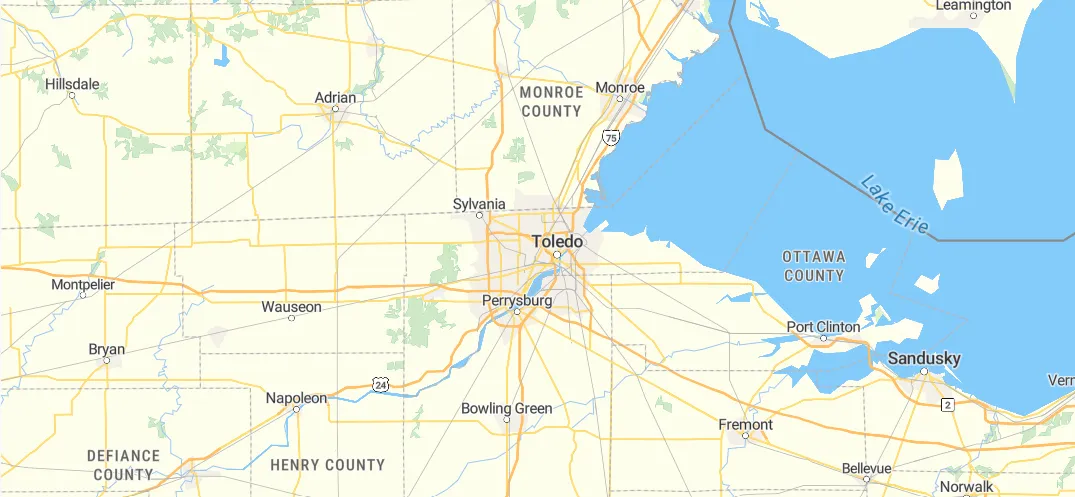Map of Metro Toledo region showing Lake Erie, Maumee Bay, the Ohio/Michigan border, and the I-75 corridor. The 11 cities Sams On Site delivers to are pinned within a ~30-mile radius of downtown Toledo.