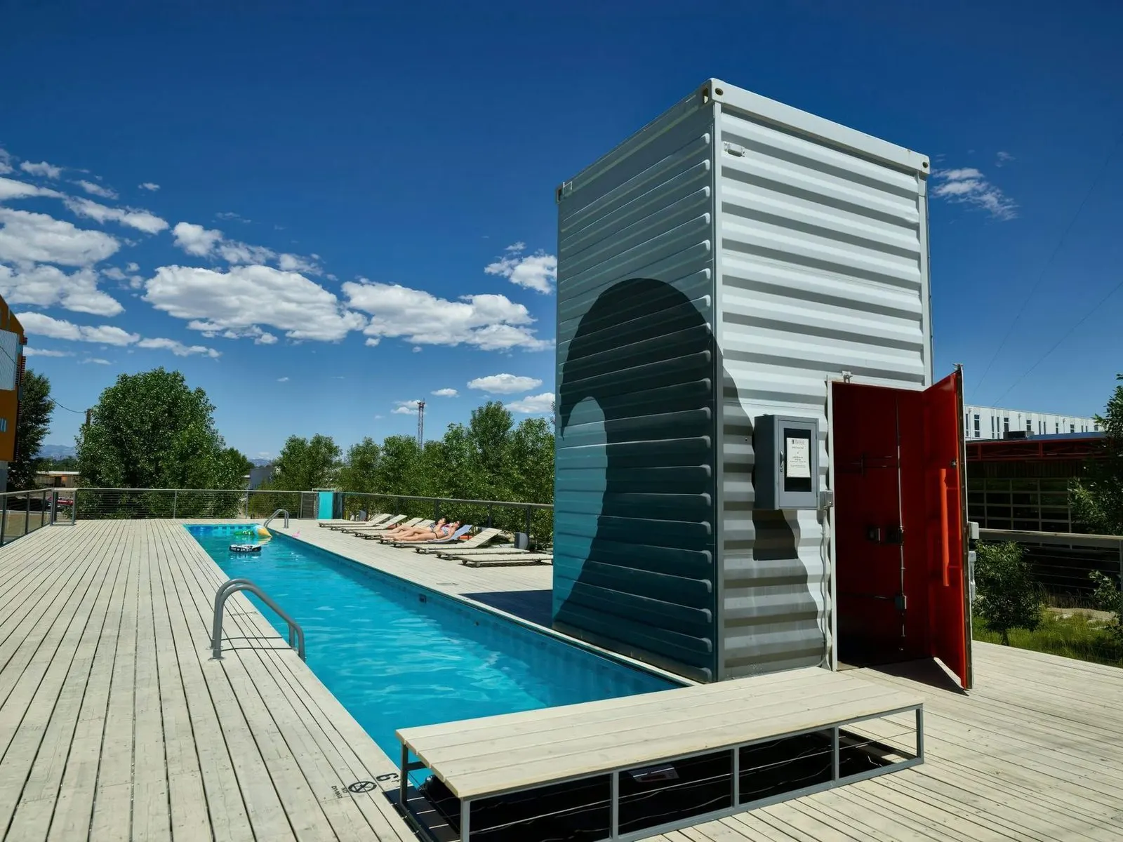 Container pool house with finished interior and exterior decking